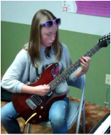 Girls learn rock guitar in Moscow, Idaho